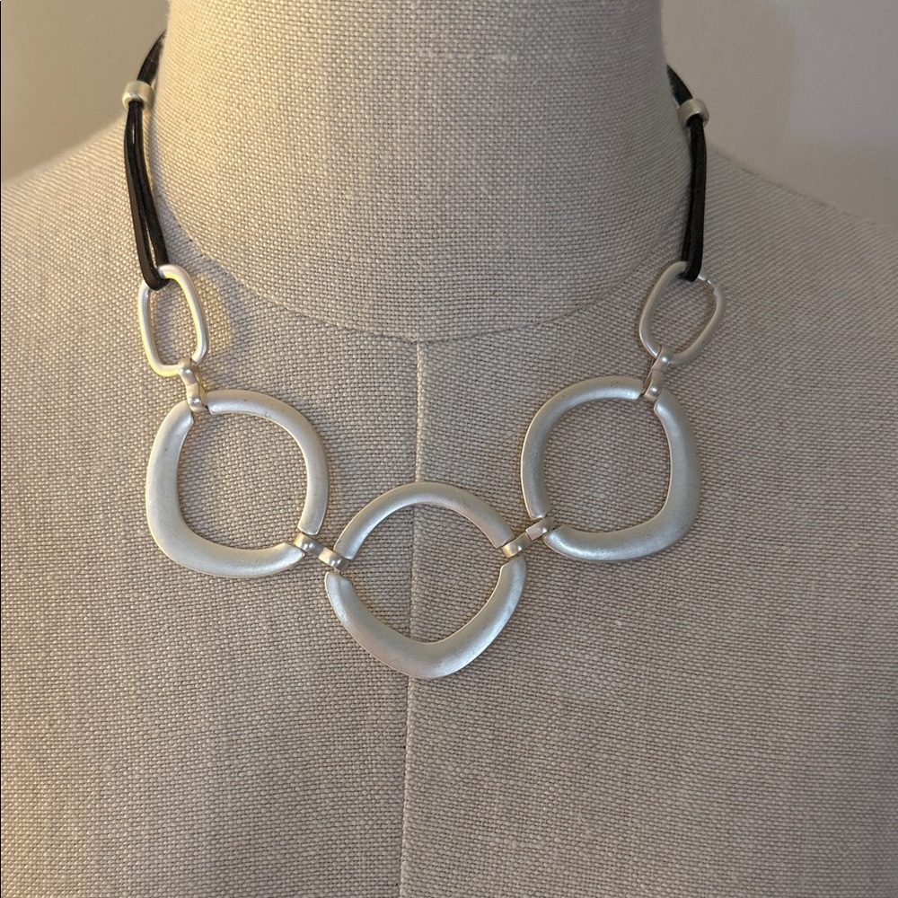 Elegant Silver Necklace with Brownish/Black Cord.